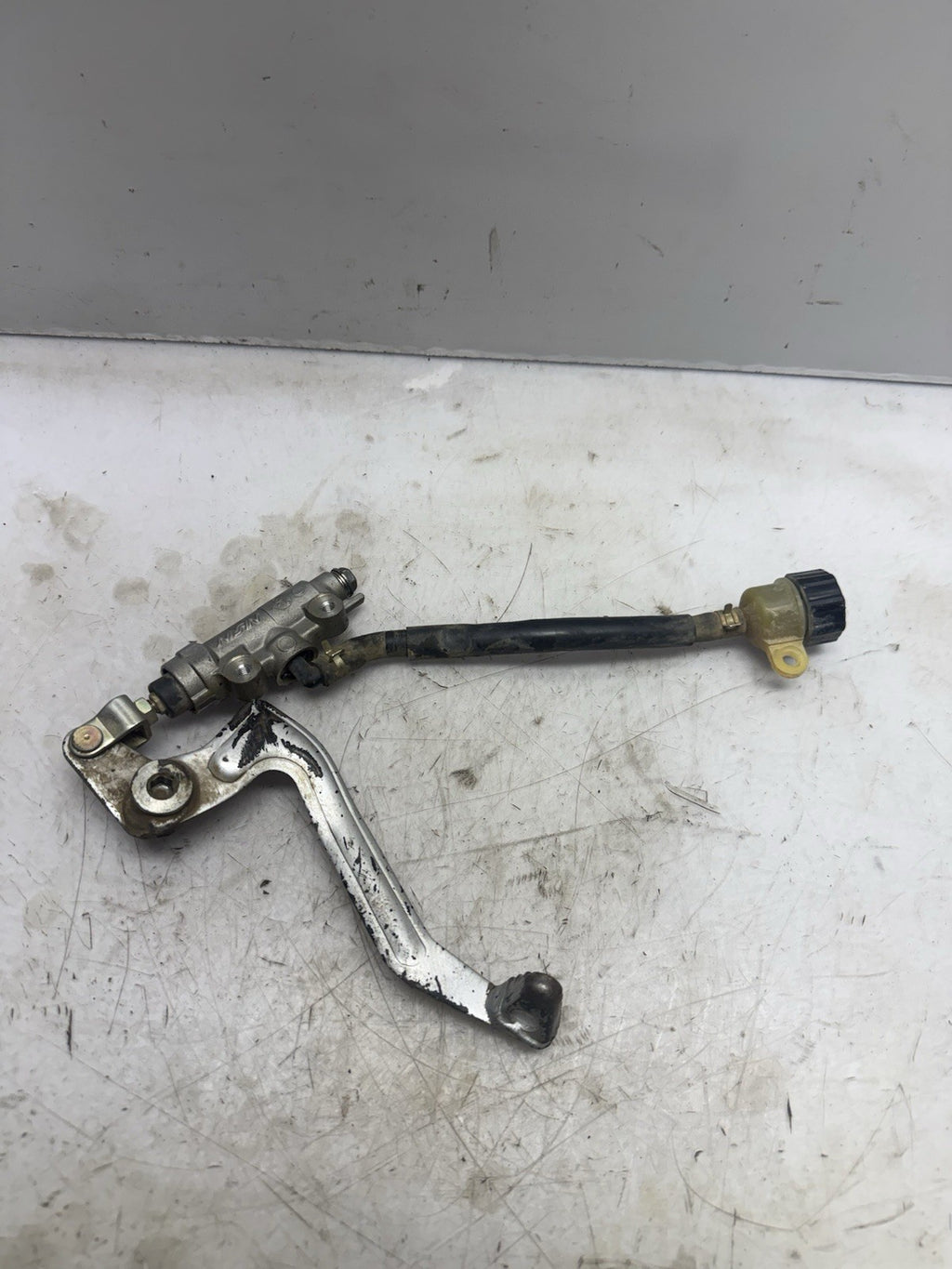 2002-2027 Kawasaki KX65 OEM REAR BRAKE MASTER CYLINDER GENUINE NISSIN w/ PEDAL