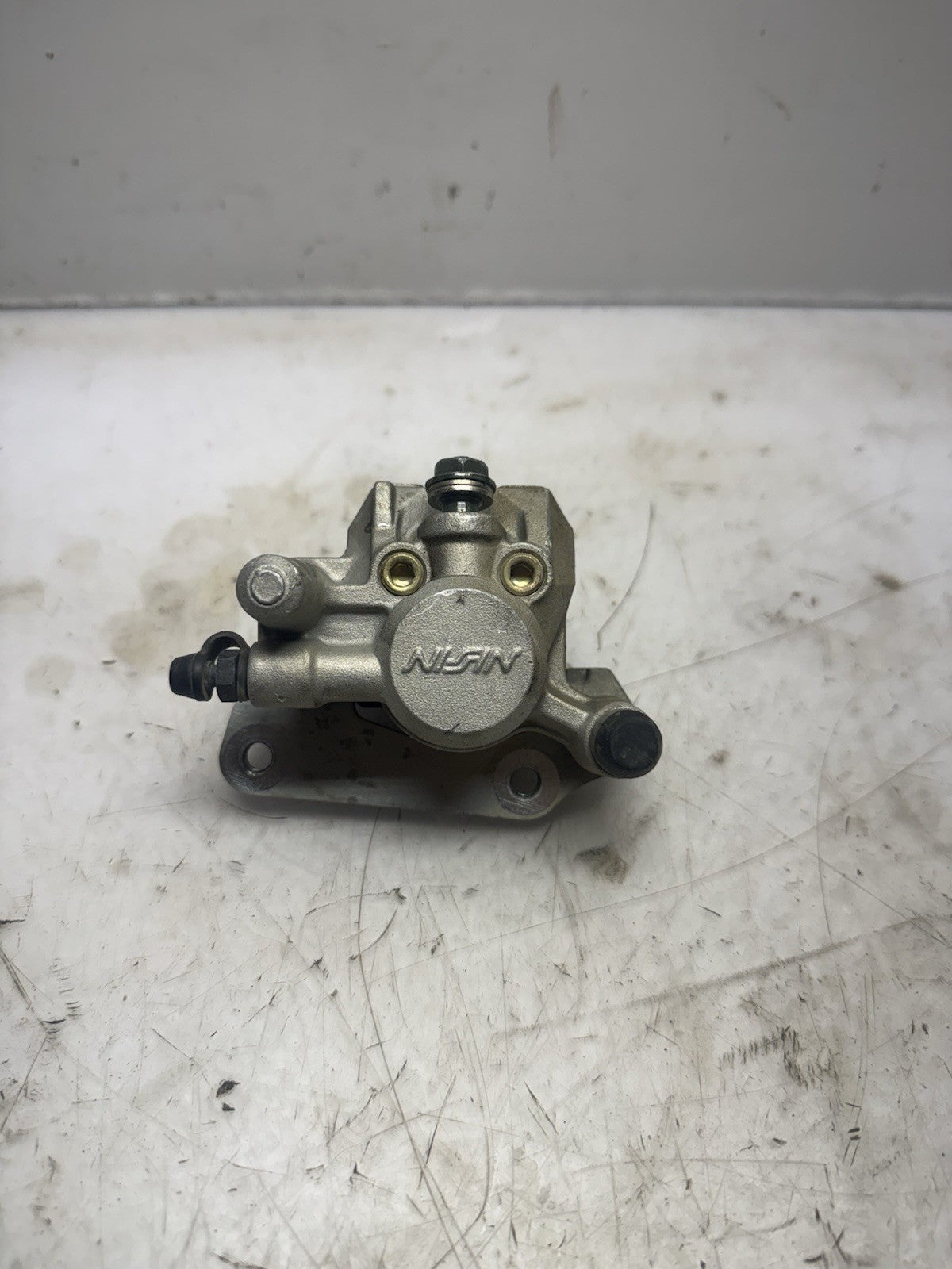 2004-2005 KAWASAKI KX65 OEM NISSIN FRONT  HYDRAULIC BRAKE CALIPER ASS’Y