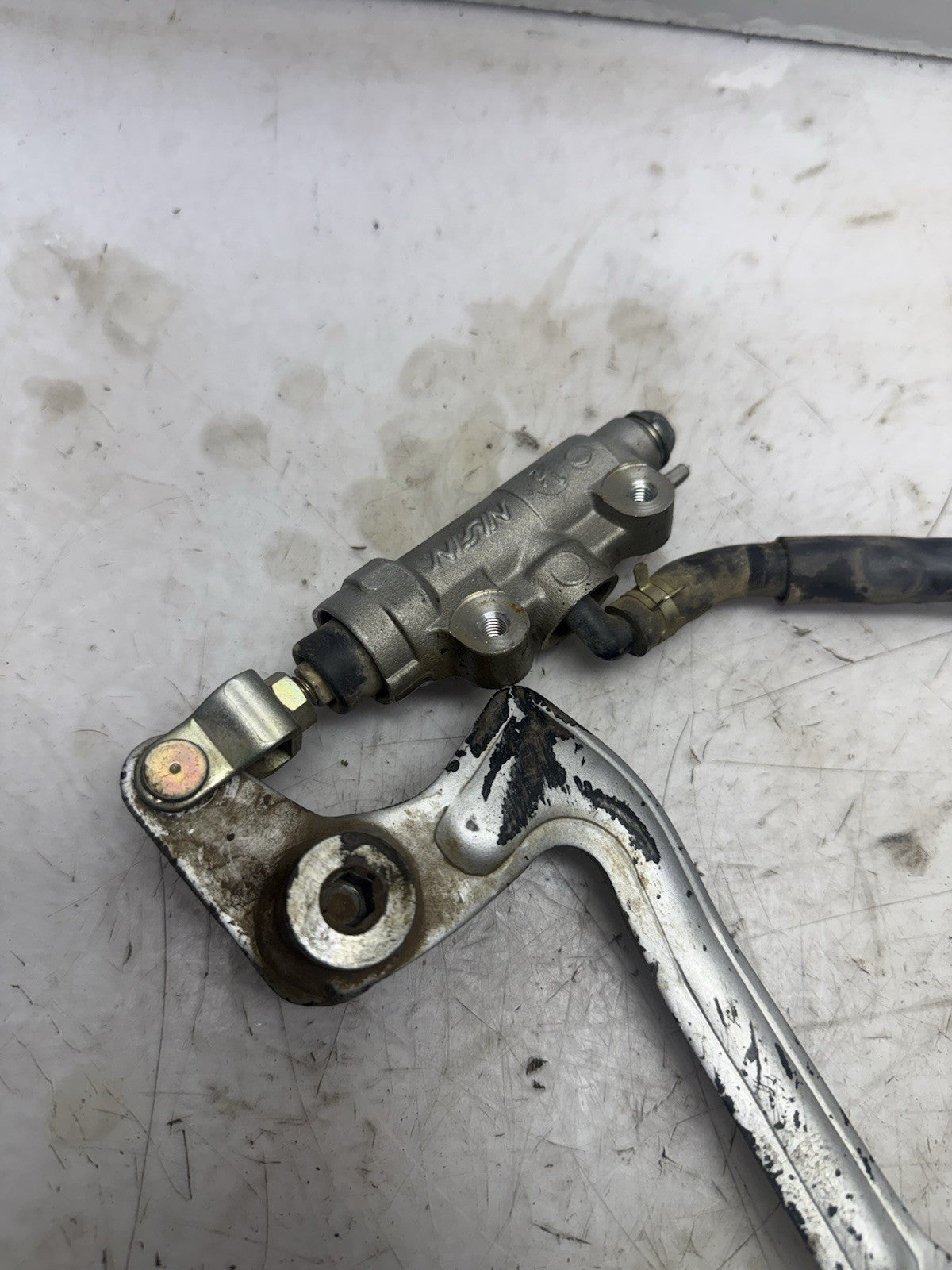 2002-2027 Kawasaki KX65 OEM REAR BRAKE MASTER CYLINDER GENUINE NISSIN w/ PEDAL