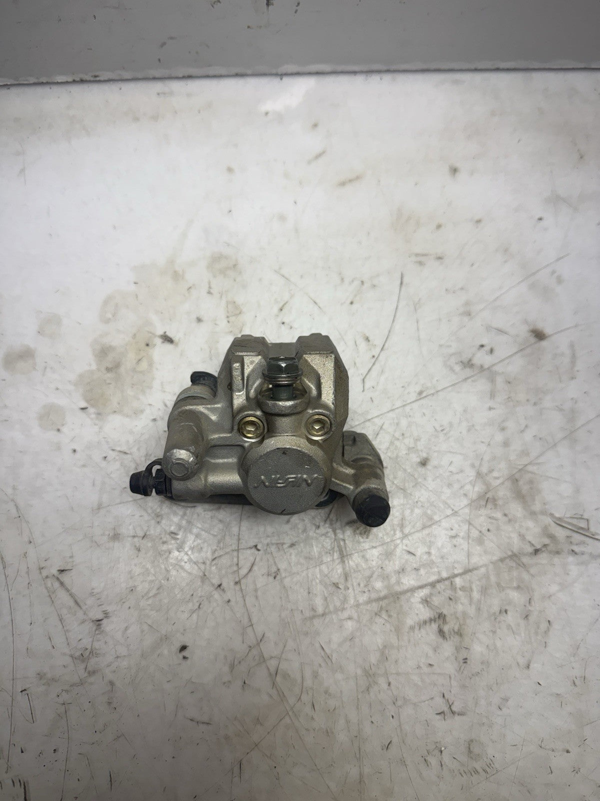 2004-2005 KAWASAKI KX65 OEM NISSIN FRONT  HYDRAULIC BRAKE CALIPER ASS’Y